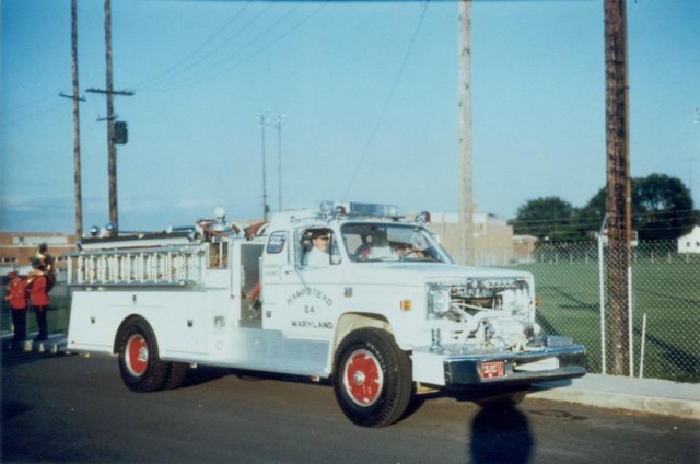 1974 Chevrolet C65 - Barton American 500 gallon booster tank, 500 gpm front mount pump pictured as E-24